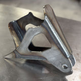 close up of a 4th gen dodge diesel trackbar bracket to replace factory bracket